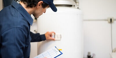 hvac technician works on system